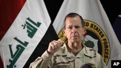 Chairman of the Joint Chiefs of Staff Adm. Mike Mullen speaks to reporters at a news conference in Baghdad, Iraq, Tuesday, Aug. 2, 2011