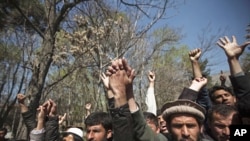 In Kabul, students shout anti-U.S. slogans during a protest against the burning of a Koran supervised by Florida-based militant fundamentalist Christian preacher, April 5, 2011