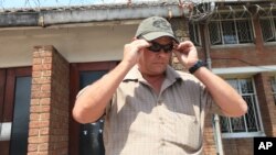 Theodro Bronkhorst, a professional hunter, appears at the magistrates court on the first day of trial in Hwange, Zimbabwe, Sept. 28, 2015.