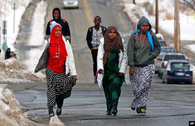 FILE - Students walk home from school in Lewiston, Maine, Jan. 26, 2016. Since February 2000, more than 5,000 Africans have come to Lewiston; now, many Somali shops, restaurants and mosques serve the city.