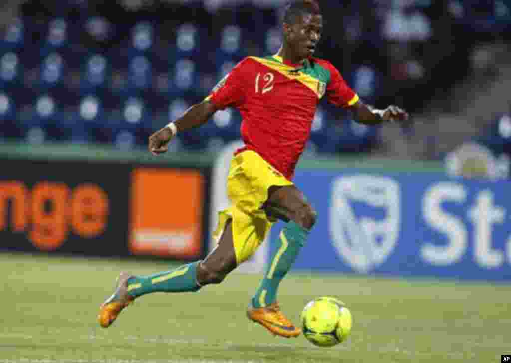 Guinea's Ibrahima Conte runs with the ball during their African Nations Cup Group D soccer match against Botswana at Franceville Stadium January 28, 2012.