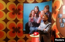 Former ABBA member Bjorn Ulvaeus poses for the media in front of an exhibit at the new "ABBA - The Museum" in Stockholm, May 6, 2013. Picture on wall shows former ABBA members (L-R) Anni-Frid Lyngstad, Bjorn Ulvaeus, Agnetha Faltskog and Benny Andersson.