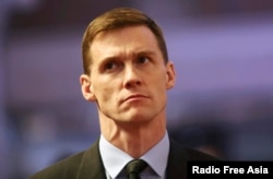 FILE - British Ambassador to Egypt John Casson, shown at Saint Mark's Coptic Orthodox Cathedral in Cairo, Feb. 17, 2015.