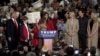 FILE - Melania Trump talks to the crowd as U.S. Republican presidential candidate Donald Trump introduces his family at a rally at the Myrtle Beach Convention Center in Myrtle Beach, South Carolina, Nov. 24, 2015.