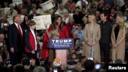 FILE - Melania Trump talks to the crowd as U.S. Republican presidential candidate Donald Trump introduces his family at a rally at the Myrtle Beach Convention Center in Myrtle Beach, South Carolina, Nov. 24, 2015.