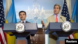 U.S. Secretary of State John Kerry (R) and Ukrainian Foreign Minister Pavlo Klimkin speak to reporters at the State Department in Washington, Tuesday, July 29, 2014.