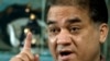 FILE - Ilham Tohti, a champion of China's Uighur minority, gestures during an interview in his Beijing home, Feb. 4, 2013.