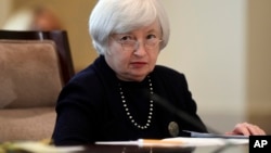 Federal Reserve Chair Janet Yellen attends a Board of Governors meeting at the Federal Reserve in Washington, Sept. 3, 2014.