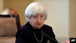 Federal Reserve Chair Janet Yellen attends a Board of Governors meeting at the Federal Reserve in Washington, Sept. 3, 2014. 