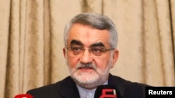 FILE - Alaeddin Boroujerdi, head of the Iranian parliamentary committee for national security and foreign policy, attends a news conference at the Iranian embassy.