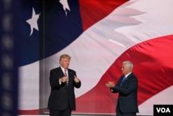 Republican presidential nominee Donald Trump, left, gives his running mate, Indiana Governor Mike Pence, a thumbs up after Pence addressed the Republican National Convention.