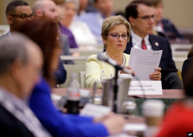 Indiana Secretary of State Connie Lawson reads notes that were handed out on voter registration during the National Association of Secretaries of State conference in Indianapolis, July 8, 2017.