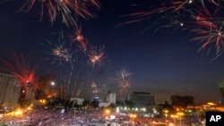 Fireworks burst over opponents of Egypt's Islamist President Mohammed Morsi in Tahrir Square in Cairo, July 2, 2013.