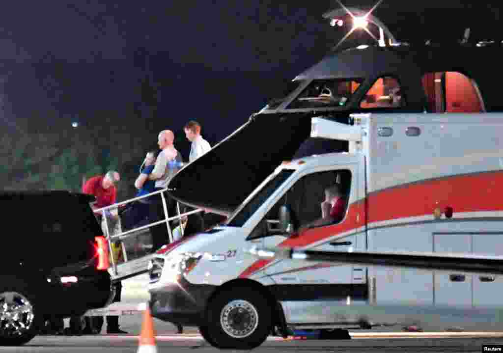 A person believed to be Otto Warmbier is transferred from a medical transport airplane to an ambulance at Lunken Airport in Cincinnati, Ohio, June 13, 2017. Warmbier, an undergraduate student at the University of Virginia, serving a 15-year prison term in North Korea for attempting to steal a propaganda poster in the communist nation, was released and medically evacuated from the reclusive country. His parents said Warmbier has been in a coma for months.