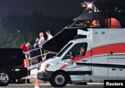 A person believed to be Otto Warmbier is transferred from a medical transport airplane to an awaiting ambulance at Lunken Airport in Cincinnati, Ohio, June 13, 2017.
