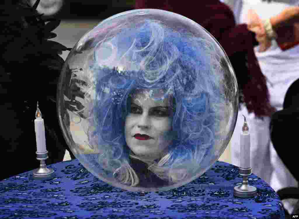 A woman wears a costume at the annual Haute Dog Howl&#39;oween parade in Long Beach, California, Oct. 28, 2018.