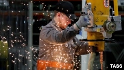 Worker at the PSMA Rus car factory, March 16, 2018