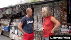 Bouquiniste Francis Robert, right, is against the UNESCO bid, fearing it will end his ability to sell the souvenirs he says he needs to survive.