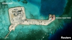 FILE - A satellite image released by the Asian Maritime Transparency Initiative at Washington's Center for Strategic and International Studies shows construction of possible radar tower facilities in the Spratly Islands in the disputed South China Sea.