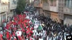 An image grab from footage uploaded on YouTube made available on September 18, 2011, shows a protest by Syrian students on the first day of school in the flashpoint city of Homs.