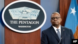 FILE - U.S. Secretary of Defense Lloyd Austin pauses while speaking during a media briefing at the Pentagon, in Arlington, Virginia, Nov. 17, 2021.