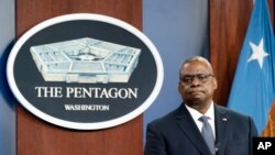 FILE - U.S. Secretary of Defense Lloyd Austin pauses while speaking during a media briefing at the Pentagon, in Arlington, Virginia, Nov. 17, 2021.