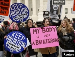 FILE - Activists demonstrate in front of the U.S. Supreme Court, Jan. 22, 2016. The day marks the anniversary of the U.S. Supreme Court's 1973 abortion ruling in Roe v. Wade.
