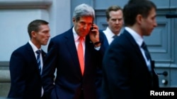 U.S. Secretary of State John Kerry makes a phonecall after a meeting in Vienna, Nov. 21, 2014.