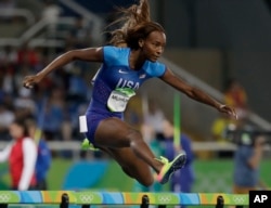United States' Dalilah Muhammad competes in a women's 400-meter hurdles semifinal during the athletics competitions of the 2016 Summer Olympics at the Olympic stadium in Rio de Janeiro, Brazil, Aug. 16, 2016.