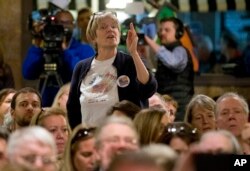 A constituent of congressman Dave Brat, R-Va., gestures as she responded to the congressman during a town hall meeting with the congressman in Blackstone, Va., Feb. 21, 2017.