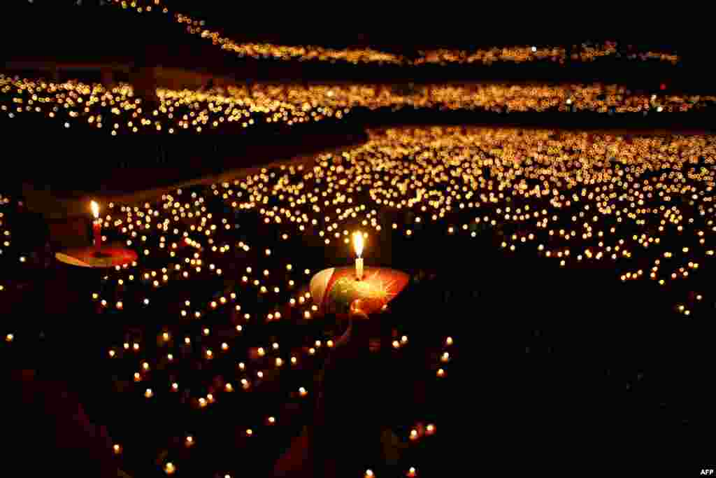 Christian worshippers attend a Christmas prayer in Surabaya. Indonesian Christians celebrated Christmas amid a warning from police that Islamic extremists may be planning to target worshippers during Christmas and New Years celebrations in the capital Jakarta and other parts of the country.