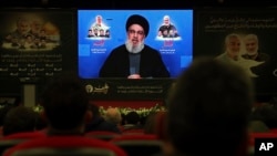 ທ່ານ Sayyed Hassan Nasrallah ຜູ້​ນຳ​ກຸ່ມ​ເຮ​ສ​ໂບ​ລາ ກ່າວ​ຢູ່​ໃນ​ວີ​ດິ​ໂອ​ທາງ​ອິນເຕີແນັດ ​ໃນ​ວັນ​ທີ 3 ມິ​ຖຸ​ນາ​, 2022 ໃນ​ພິ​ທີຄົບ​ຮອບ 2 ປີ ຂອງ​ການ​ລອບ​ສັງ​ຫານນາຍ​ພົນ Qassem Soleimani ຂອງ​ອີ​ຣ່ານທີ່​ຖືກ​ໂຈມ​ຕີ​ໂດຍ​​ເຮືອ​ບິນບໍ່​ມີ​ຄົນ​ຂັບ ​ຂອງ ສ​ຫລ ໃນ​ນະ​ຄອນ​ຫລວງແບກ​ແດັດ​ຂອງ​ອີ​ຣັກ