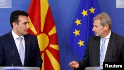 Macedonian Prime Minister Zoran Zaev and European Neighborhood Policy and Enlargement Negotiations Commissioner Johannes Hahn, right, address a joint news conference after their meeting at the EU Commission headquarters in Brussels, Belgium June 12, 2017.