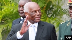 Former Angolan President Jose Eduardo dos Santos (L) waves during the swearing in ceremony of the new president of Angola on September 26, 2017 in Luanda. - Jose Eduardo dos Santos's 38-year reign over Angola finally came to an end when his hand-picked su