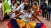 Followers of San Juan Bautista, known as "San Juaneros," dance during a ceremony to celebrate after UNESCO recognized the Festive cycle around the devotion and worship of Saint John the Baptist, as Intangible Cultural Heritage of Humanity, in Caracas, Venezuela, Dec. 14, 2021. 