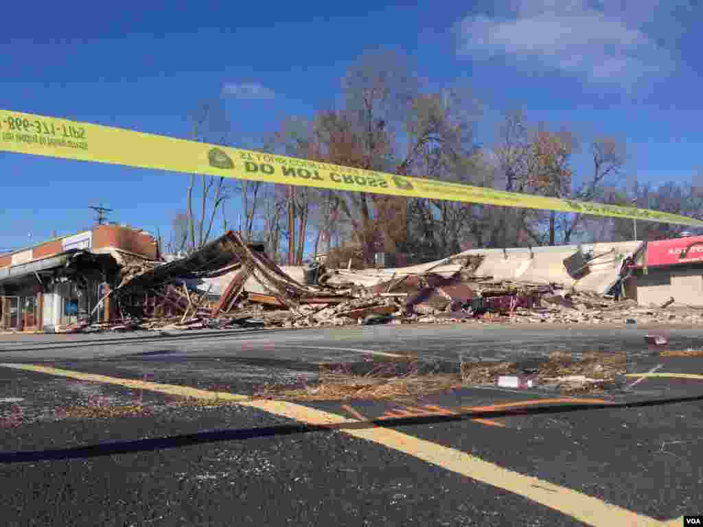 Police tape blocks off a large swath of commercial property destroyed in the violence that followed the grand jury decision not to indict police officer Darren Wilson in the shooting death of Michael Brown, Ferguson, Missouri, Nov. 25, 2014. (Kane Farabaugh/VOA)
