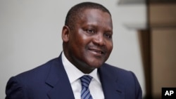 FILE - In this photo taken, Monday, Oct. 8, 2012 Nigerian billionaire businessman Aliko Dangote attends a global business environment meeting in Lagos, Nigeria. 