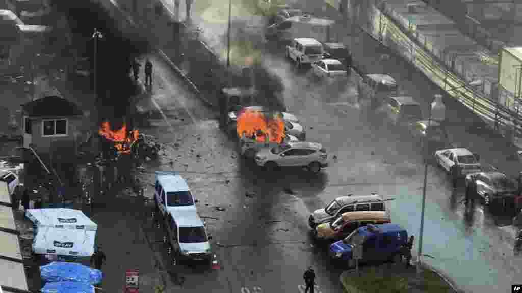 Cars burn after a car bomb explosion in Izmir, Turkey, Thursday, Jan. 5, 2017.