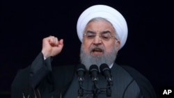 FILE - Iranian President Hassan Rouhani speaks during a ceremony celebrating the 40th anniversary of the Islamic Revolution, at the Azadi, Freedom, Square in Tehran, Feb. 11, 2019.