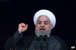 FILE - Iranian President Hassan Rouhani speaks during a ceremony in Azadi Square in Tehran, Feb. 11, 2019.