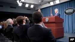 Defense Secretary Chuck Hagel speaks with reporters after announcing the U.S. will add 14 interceptors to a West Coast-based U.S.-based missile defense system, at the Pentagon, March 15, 2013.