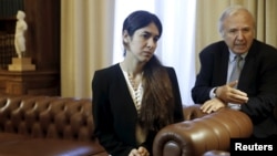 FILE - Nadia Murad Basee Taha, a 21-year-old Iraqi woman of the Yazidi faith who was abducted and held by the Islamic State for three months, meets with Greek President Prokopis Pavlopoulos (not pictured) at the Presidential Palace in Athens, Greece, Dec.