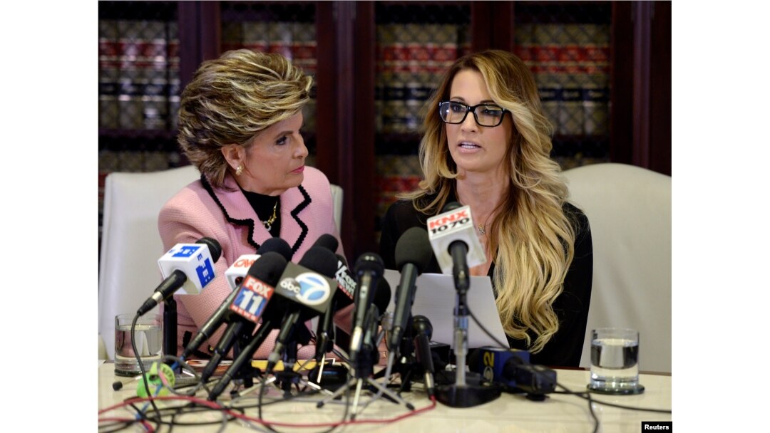 Jessica Drake speaks to reporters about allegations of sexual misconduct against Donald Trump, alongside lawyer Gloria Allred (L) during a news conference in Los Angeles, California, Oct. 22, 2016.