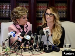 Jessica Drake speaks to reporters about allegations of sexual misconduct against Donald Trump, alongside lawyer Gloria Allred (L) during a news conference in Los Angeles, California, Oct. 22, 2016.