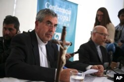 Monsignor Santiago Silva, left, and Monsignor Fernando Ramos, president and general secretary of the Episcopal Conference of Chile, take part in a press conference about Pope Francis' recent letter, in Punta de Tralca, Chile, April 11, 2018.