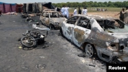 Burnt out cars and motorcycles are seen at the scene of an oil tanker explosion in Bahawalpur, Pakistan, June 25, 2017.