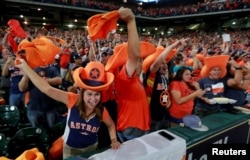 Houston Astros fans watch and cheer as their team plays in Los Angeles during a World Series Game 7 watch party at Minute Maid Park in Houston, Texas, Nov. 1, 2017.