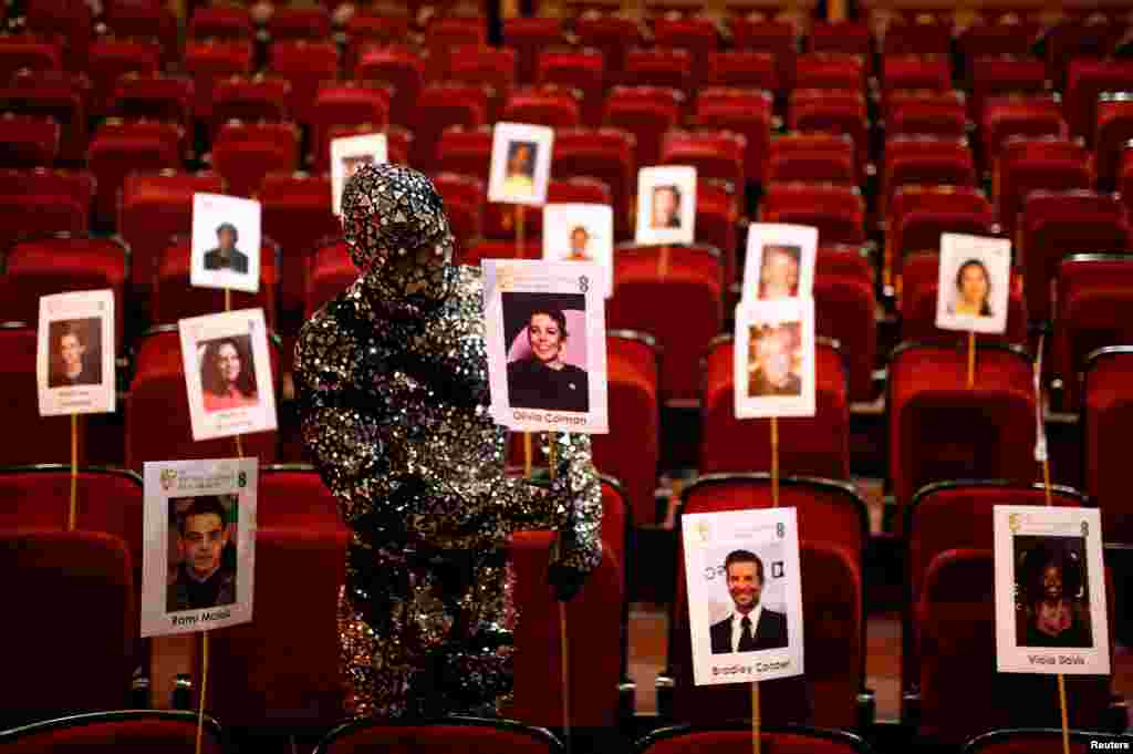 A Cirque du Soleil cast member prepares for the British Academy of Film and Television Awards (BAFTA) ceremony at the Royal Opera House in London.