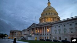 FILE - A view of the U.S. Capitol building is shown at dusk in Washington, October 2013.