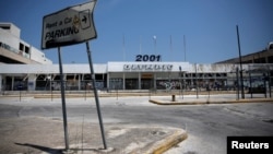 FILE - A view of the main entrance of the former international Hellenikon airport in Athens, Greece, July 16, 2017. Developers are one step closer to turning the site into a coastal resort.